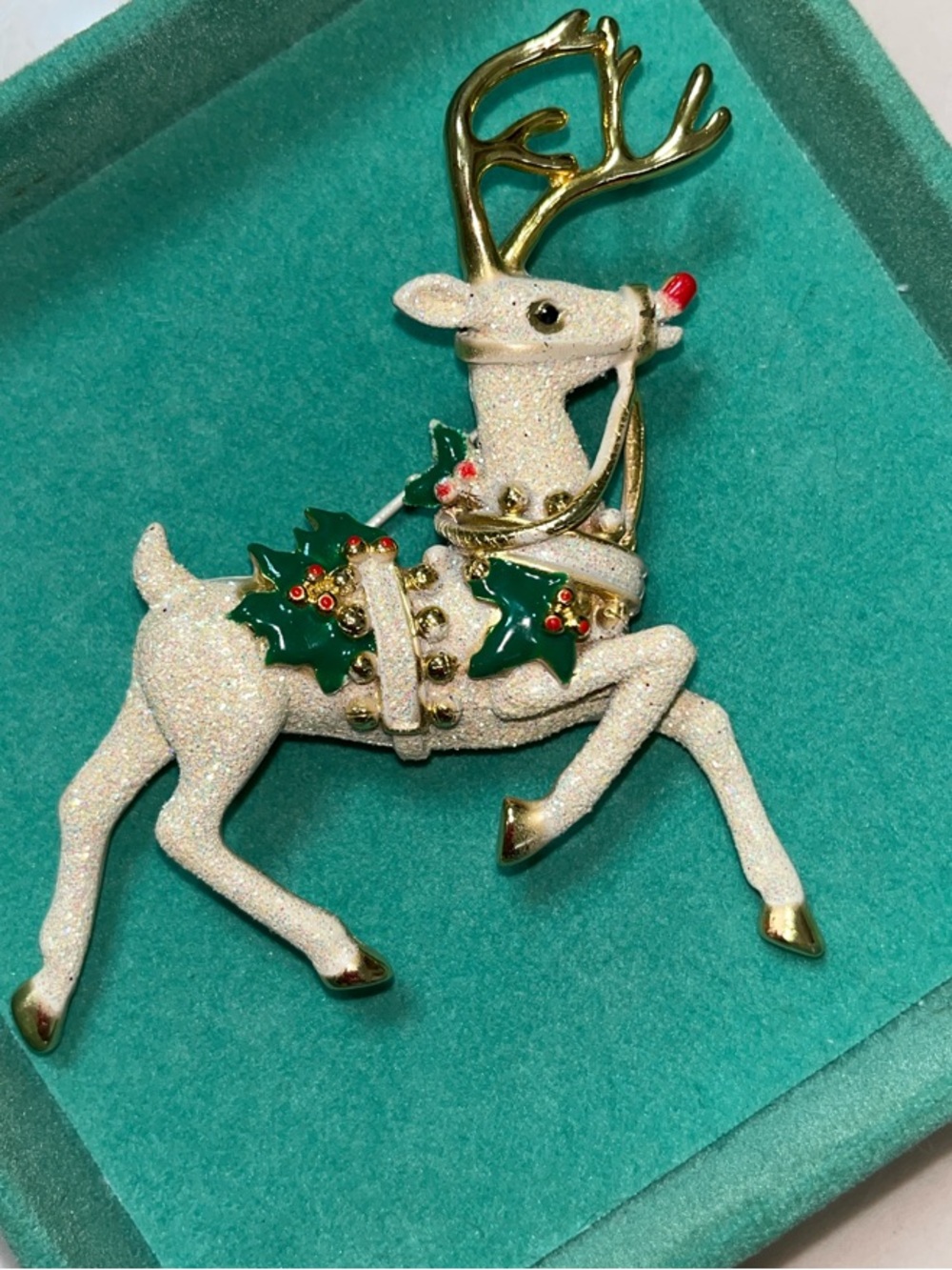 Vintage-Inspired White Glitter Reindeer Brooch with Green Holly Accents